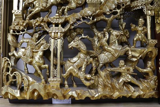 Six Chinese carved giltwood panels of soldiers amid pavilions